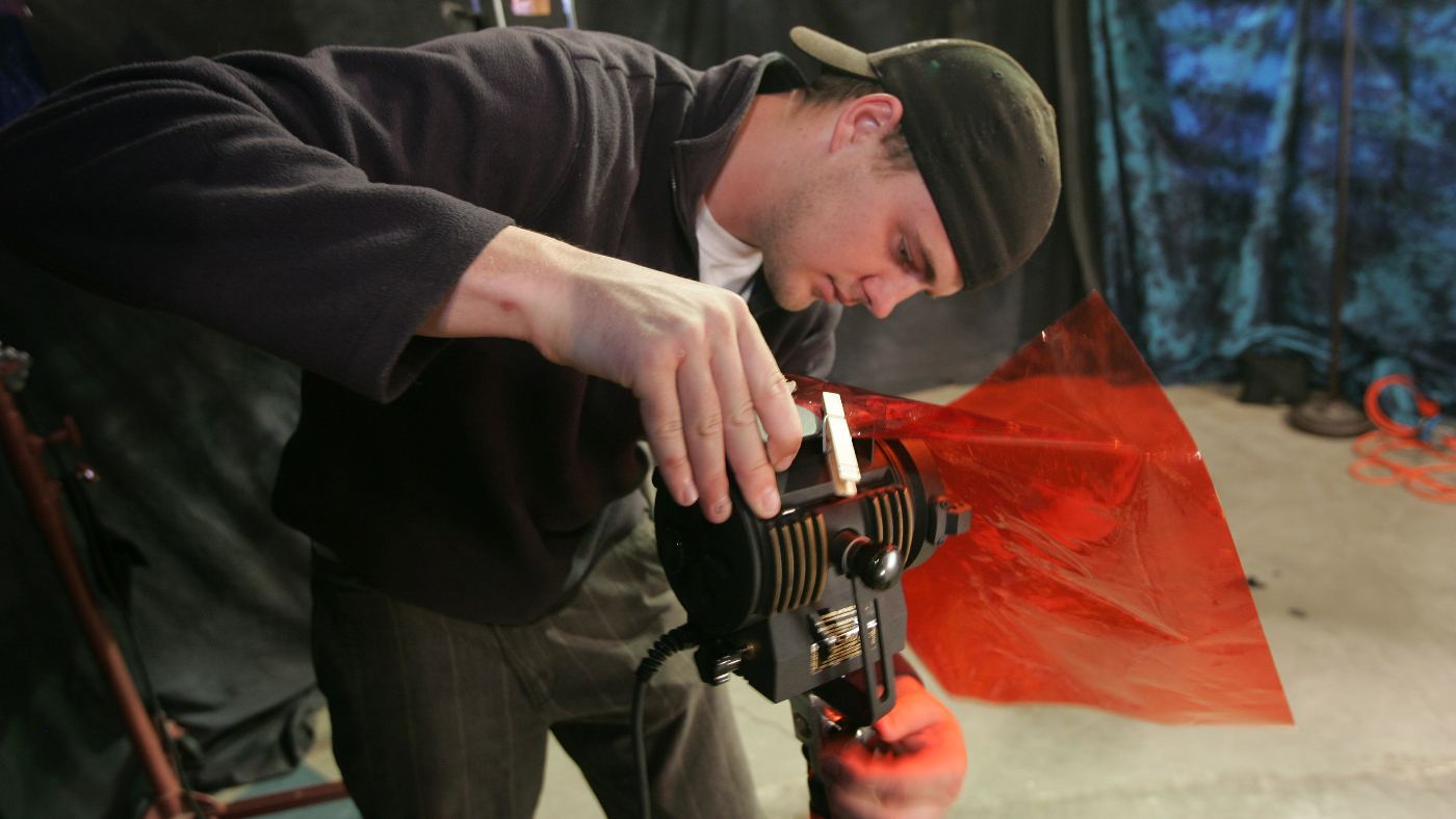 Student Adjusting Lights